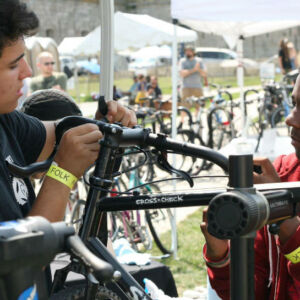 Local kids working on bikes at Newport Folk Fest