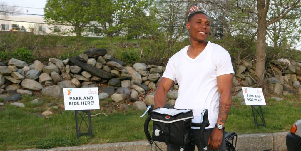 Man taking advantage of Bike Newport's Park & Bike at the Y