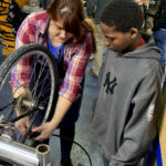 bike repair instructor and student