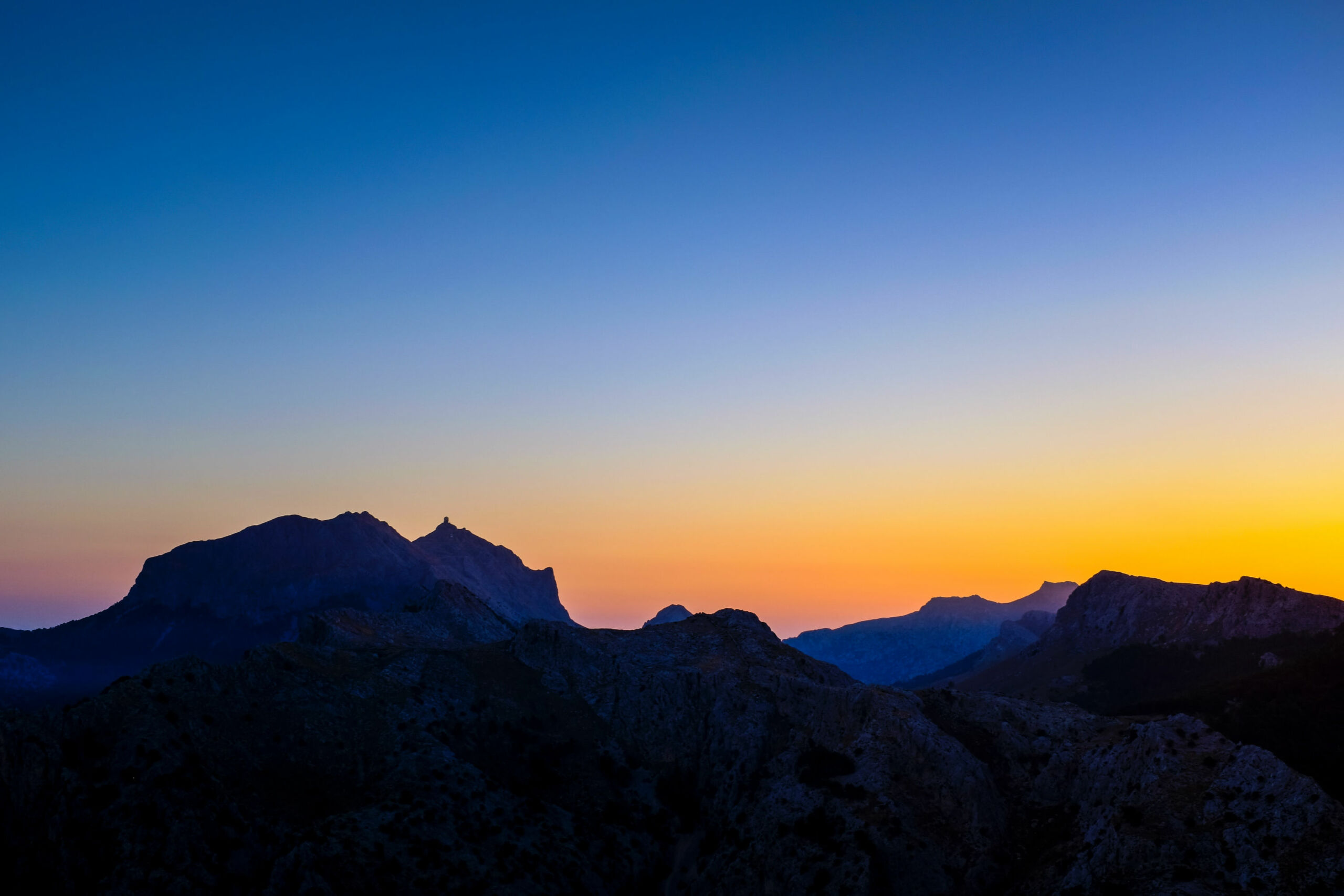 Dark mountain range at sunset