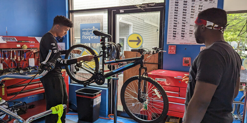 Alexis helping someone at the bike garage