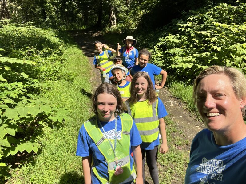 campers hiking on a trail