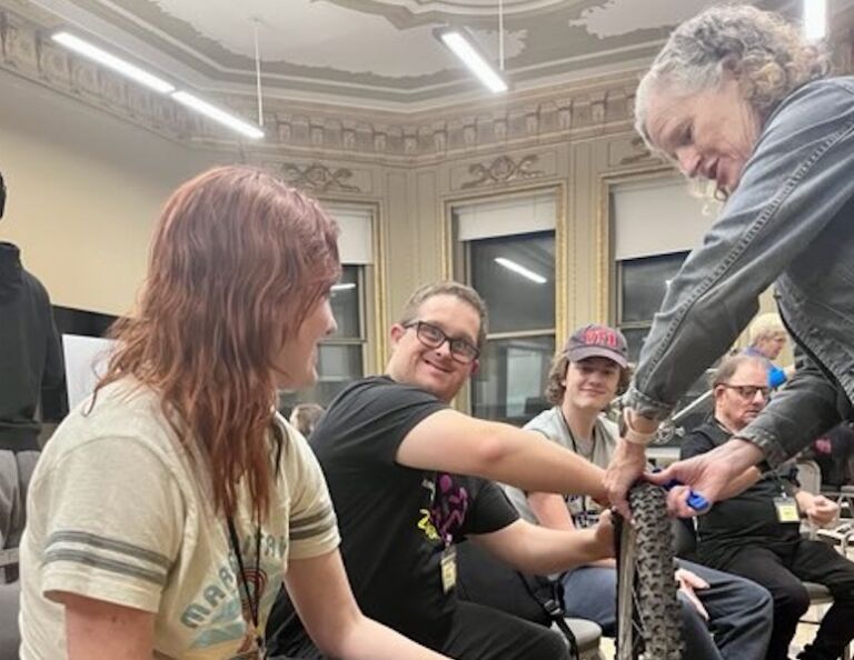 a group of students learning to repair bicycles