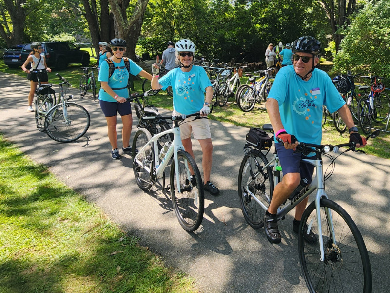 Three riders in 10 Spot shirts ready to join the ride