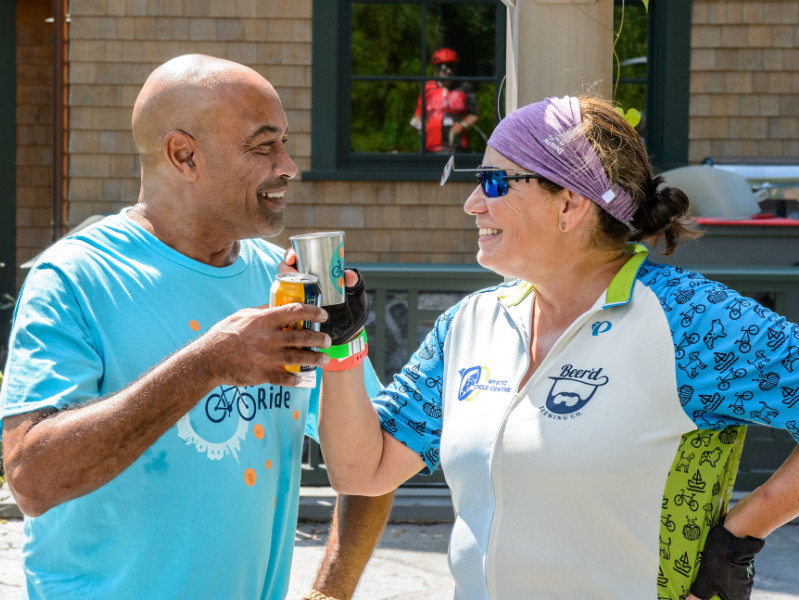 Two celebrants toast the 10 Spot Ride