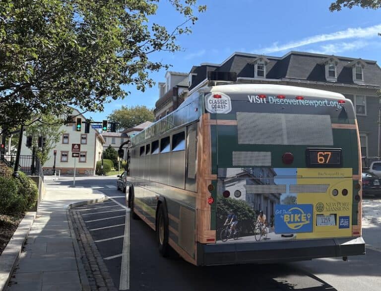 Bike Newport public transit bus promoting cycling tours in Newport, Rhode Island for eco-friendly transportation.