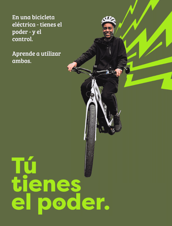 Bike Newport person riding electric bike smiling empowerment sustainability.