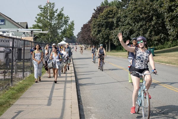 Cyclist waving at the camera
