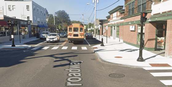 A winter street scene showing snow outlines of traffic patterns and pedestrian crosswalks to reveal street usage and cycling opportunities in Newport.