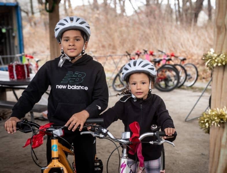 Children get new bikes at the Holiday Bike Giveaway