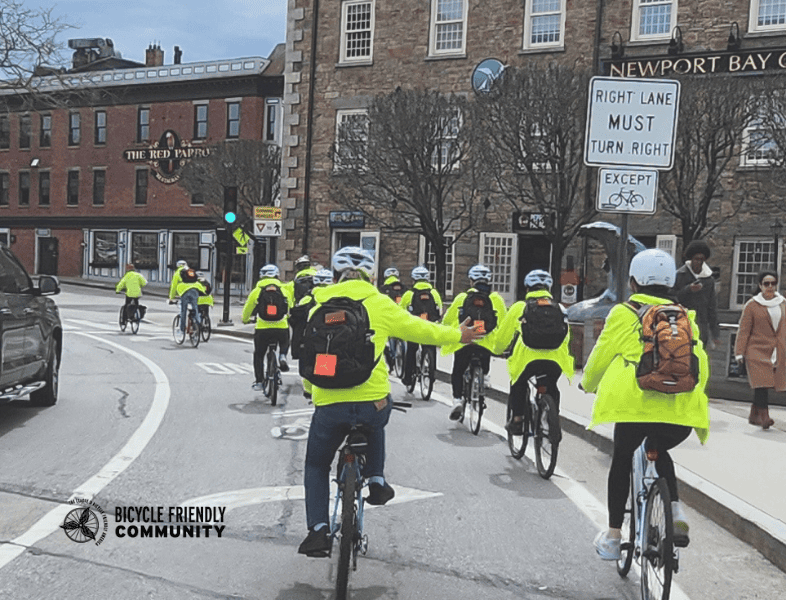 Diverse group of cyclists advocating for inclusive biking in Newport, emphasizing community engagement and promoting bicycle-friendly initiatives.
