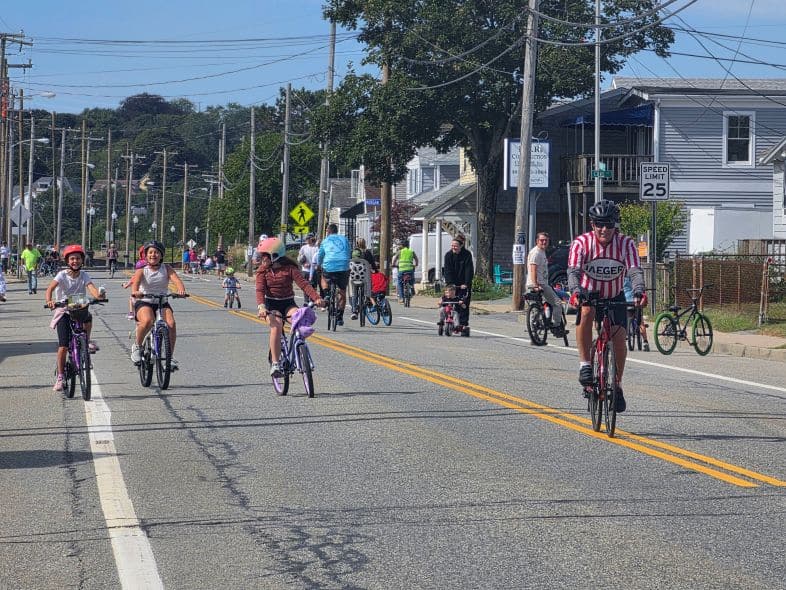 People enjoying the open road at Sakonnet Coastal Bike and Stroll